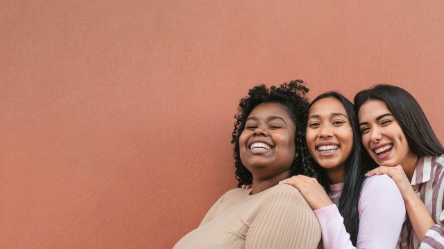 three friends showing their recently whitened teeth