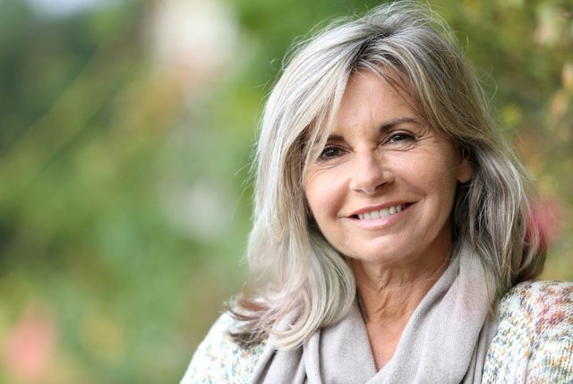 woman recieived mini implants at Allouez Family Dental