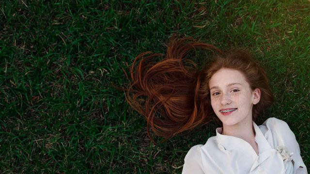 a young girl with braces