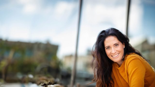 a middle-aged woman smiling