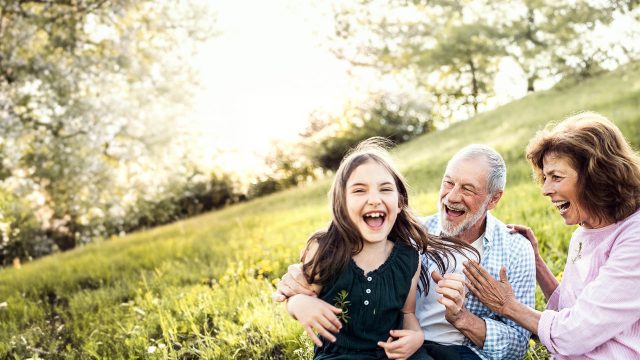 grandparents with their granddaughter