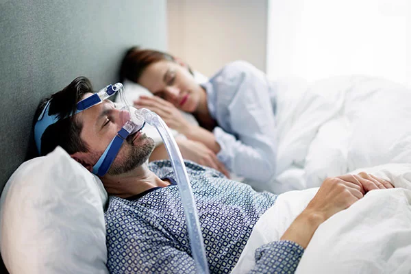 man has a cpap mask on