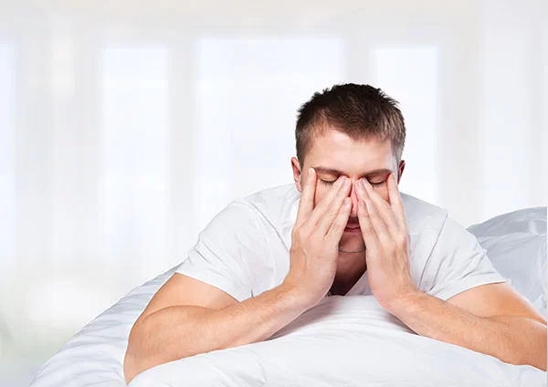 man waking up restless